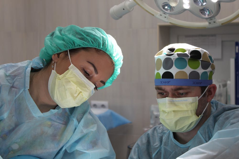 Two doctors busy in an operation