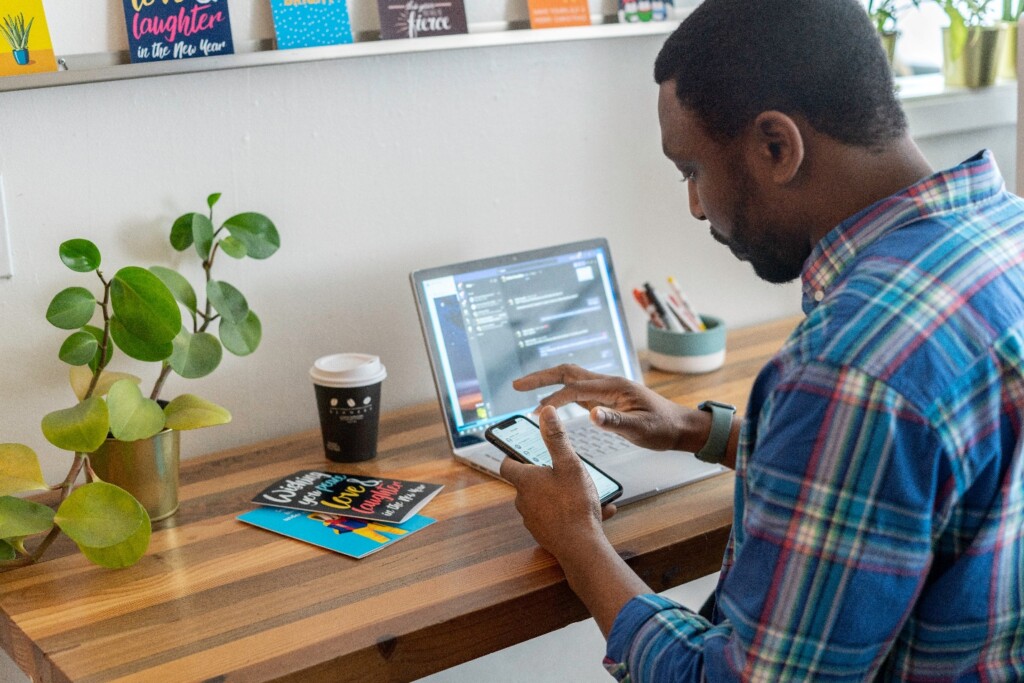A Man Checking His Phone during Work