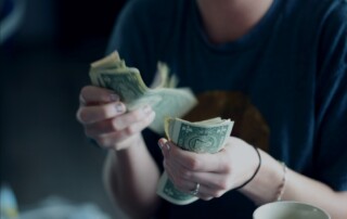A Woman Counting Cash