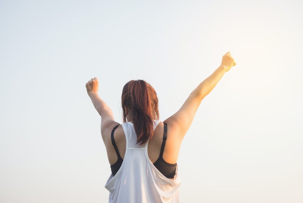 A Woman Raising Both Her Hands