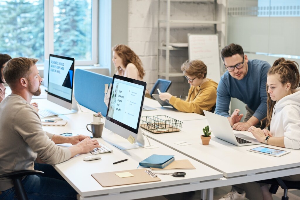 Employees Working on Computers and Laptops