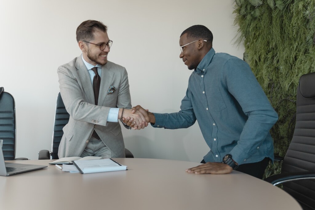 Men shaking hands after an interview