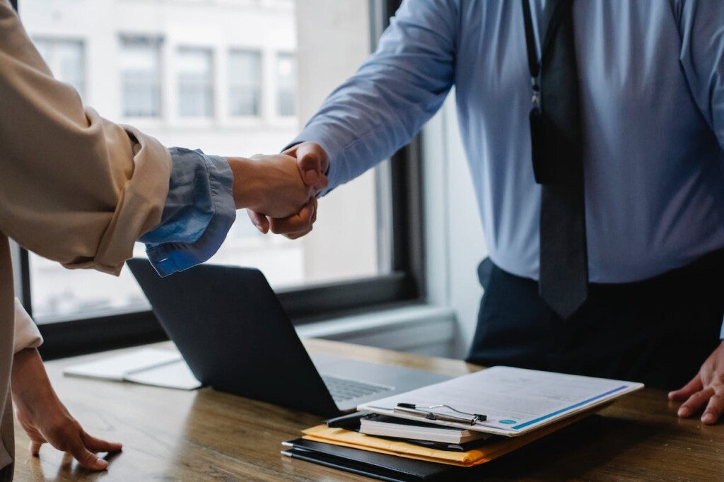 Job Candidate and HR Employee Shaking Hands