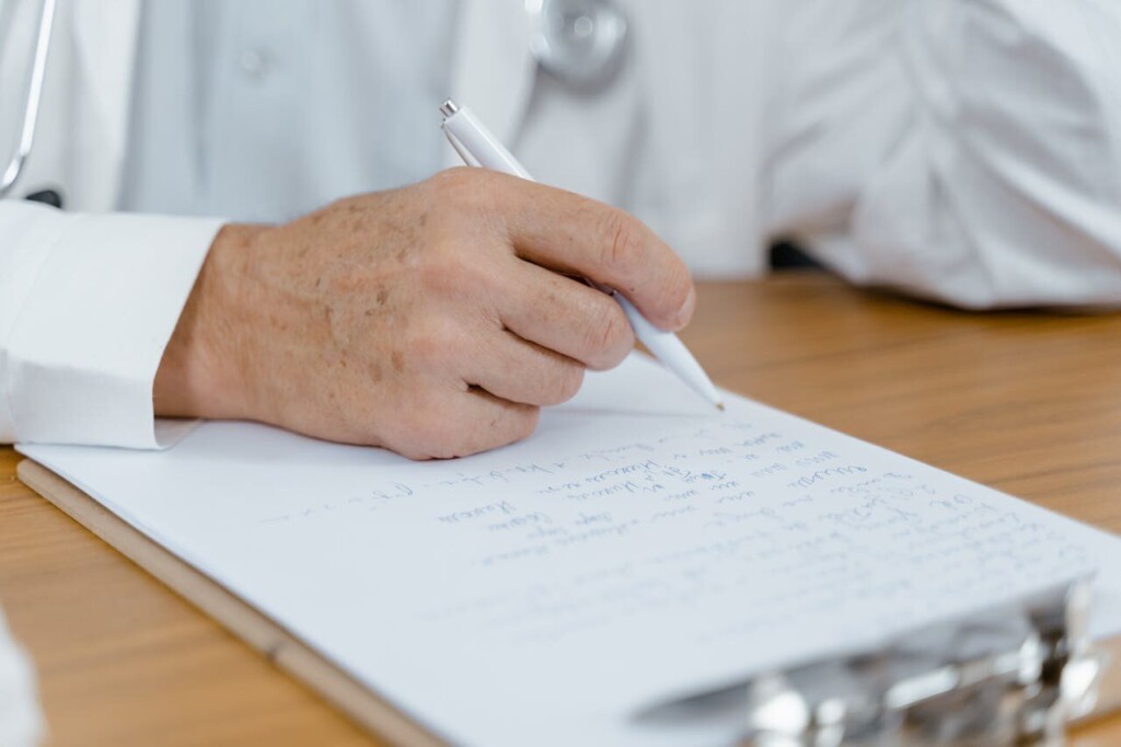 Person reviewing paperwork for ACA reporting compliance